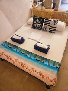 En eller flere senge i et værelse på La casetta del marinaio