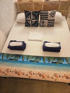 En eller flere senge i et værelse på La casetta del marinaio