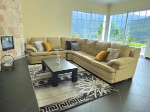 a living room with a couch and a coffee table at Vista Ventura in Ponta Delgada