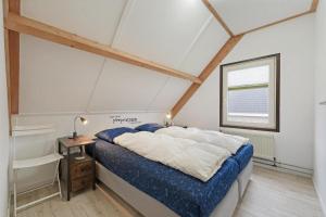 Postel nebo postele na pokoji v ubytování Mosselbank 22 - Noordzeepark Ouddorp - Swiss Mossel