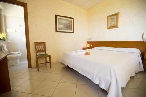 Postel nebo postele na pokoji v ubytování Albergo La Principessa