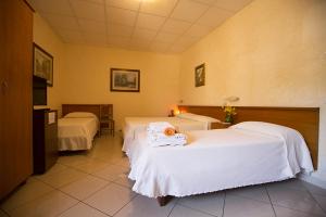 Кровать или кровати в номере Albergo La Principessa