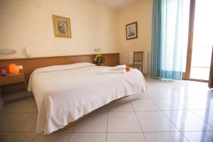 Postel nebo postele na pokoji v ubytování Albergo La Principessa