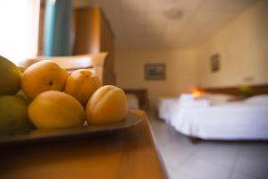 Postel nebo postele na pokoji v ubytování Albergo La Principessa