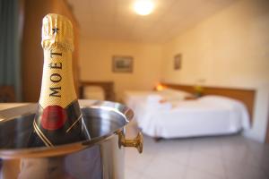 Postel nebo postele na pokoji v ubytování Albergo La Principessa