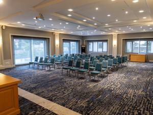 a conference room with chairs and a podium in the middle at Shirvan Grand Hotel Shamakhi in Shamakhi +97 photos