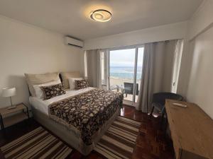 Giường trong phòng chung tại Infante Home