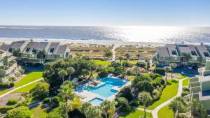 an aerial view of a resort with a pool and beach at Mariner's Walk 5F - Ocean View Condo! Pool! in Isle of Palms
