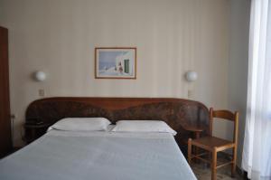 Postel nebo postele na pokoji v ubytování Hotel Cecile