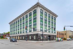 a large green and white building on a city street at Modern Elegance: Timeless Crawfordsville Studio! in Crawfordsville