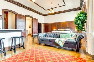 a bedroom with a bed and a couch at Modern Elegance: Timeless Crawfordsville Studio! in Crawfordsville