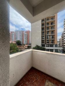 a balcony with a view of some buildings at Ete in Tbilisi City
