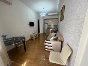 a living room with a couch and a table at Ete in Tbilisi City