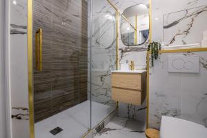 a bathroom with a shower and a sink at The Smile House // Bussy-Saint-Georges in Bussy-Saint-Georges +26 photos