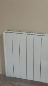 a row of white cabinets against a white wall at O'Briens Luxury Studio City Centre in Galway