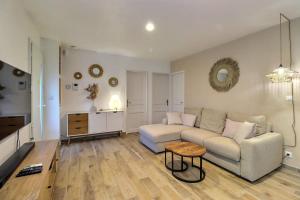 a living room with a couch and a table at The Maisonnette in the pines in Ventabren