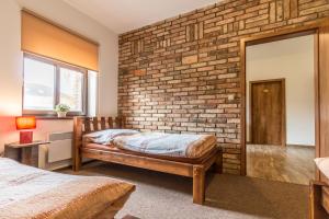 Postel nebo postele na pokoji v ubytování Apartmány U Babičky