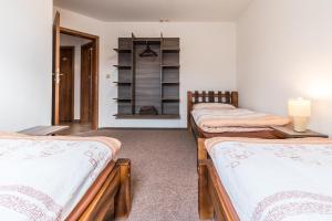 Postel nebo postele na pokoji v ubytování Apartmány U Babičky