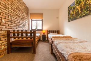 Postel nebo postele na pokoji v ubytování Apartmány U Babičky