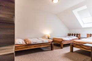 Postel nebo postele na pokoji v ubytování Apartmány U Babičky