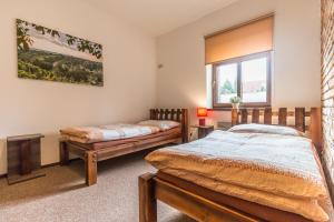 Postel nebo postele na pokoji v ubytování Apartmány U Babičky