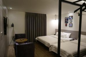 Postel nebo postele na pokoji v ubytování MU Hotel