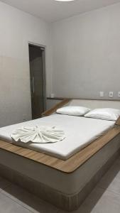 Postel nebo postele na pokoji v ubytování Hotel Samaritano