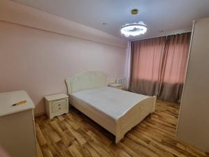Ένα ή περισσότερα κρεβάτια σε δωμάτιο στο Квартира 3 ком 70 кв