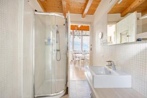 a bathroom with a shower and a sink at Casa magnifica Valle Camonica in Cimbergo +42 photos