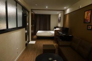 Postel nebo postele na pokoji v ubytování MU Hotel