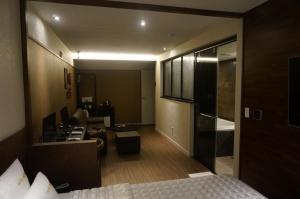 Postel nebo postele na pokoji v ubytování MU Hotel