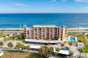an aerial view of a hotel and the ocean at Beach Dont My Vibe in Ormond Beach