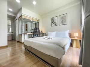 Un pat sau paturi într-o cameră la Prime Sukhumvit Living - BTS Phrom Phong - Ultra Fast WiFi +36 fotografii