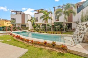 an image of a house with a swimming pool at Tranquil Jungle Retreat w Pool Bikes and Walk to Town in San Francisco