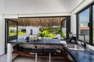 a kitchen with a counter and a large window at 2 legit 2 quit in San Pancho in San Francisco