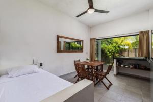 a bedroom with a bed and a table with chairs at 2 and 2 makes a great Getaway in San Francisco
