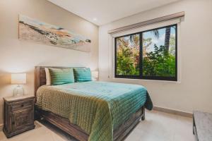a bedroom with a bed and a window at Casa de Luz Beachfront Oasis w Ocean Views Pool in San Francisco +45 photos