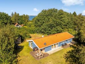 an overhead view of a house with an orange roof at Holiday Home Elizabeth - 150m to the fjord by Interhome in Furland