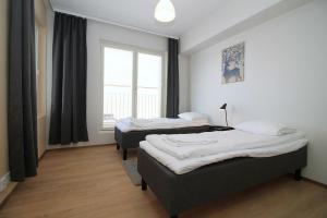 Ένα ή περισσότερα κρεβάτια σε δωμάτιο στο Central Apartment for 4