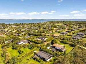 an aerial view of a small village next to the water at Holiday Home Berner - 500m to the fjord by Interhome in Flovtrup