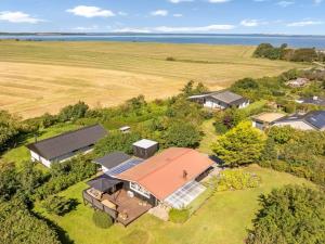 an aerial view of a house on a field at Holiday Home Berner - 500m to the fjord by Interhome in Flovtrup