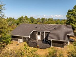 a house with solar panels on the roof at Holiday Home Marisol - 250m to the fjord by Interhome in Furland