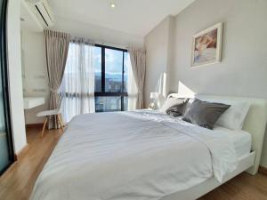 Voodi või voodid majutusasutuse Nimman Center Mountain View With Rooftop Pool toas +45 fotot