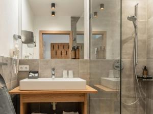 a bathroom with a sink and a shower at Studio Studio Taxacher by Interhome in Krinberg