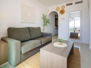 a living room with a couch and a coffee table at Apartment Imperial Park-23 by Interhome in Casas de Torrat