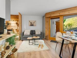 a living room with a couch and a table at Apartment Rochemont B26 by Interhome in Icogne
