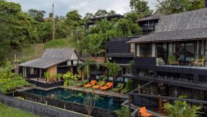 an aerial view of a house with a swimming pool at Sumba Lodge in Manuel Antonio