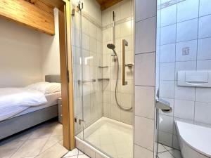 a shower with a glass door in a bathroom at Apartment Feingeist by Interhome in Löffingen