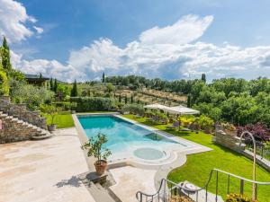 an outdoor swimming pool in a yard with a garden at Holiday Home Casa Padronale by Interhome in Corti +49 photos