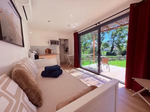 a living room with a large sliding glass door at Oasis in Ambonil